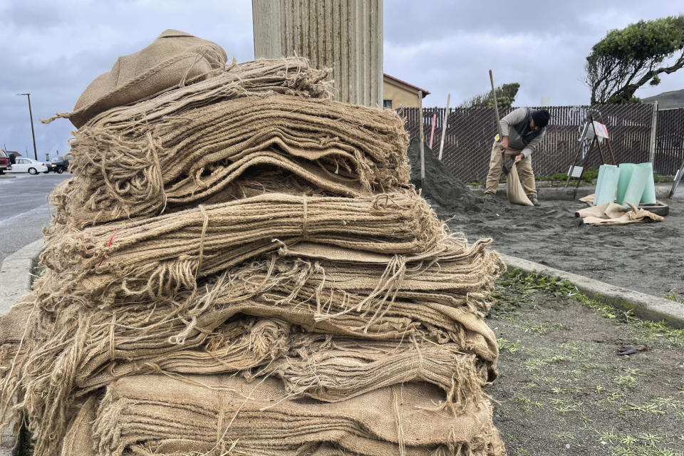 A man fills sandbags, Wednesday, Jan. 4, 2023, in Pacifica, Calif. A major winter storm approached California on Wednesday causing crews to rush to clear storm drains in preparation for flooding and strong winds, as parts of the Midwest dealt with snow, ice or tornadoes, and the South recovered from strong overnight storms. (AP Photo/Haven Daley)