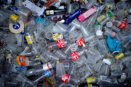 FILE PHOTO: Plastic and glass waste lies on the ground during the Day of San Sebastian in the Basque coastal town of San Sebastian, Spain, January 20, 2018. REUTERS/Vincent West/File Photo