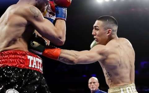 Teofimo Lopez, right, punches Finland's Edis Tatli - Credit: &nbsp;Frank Franklin II/AP