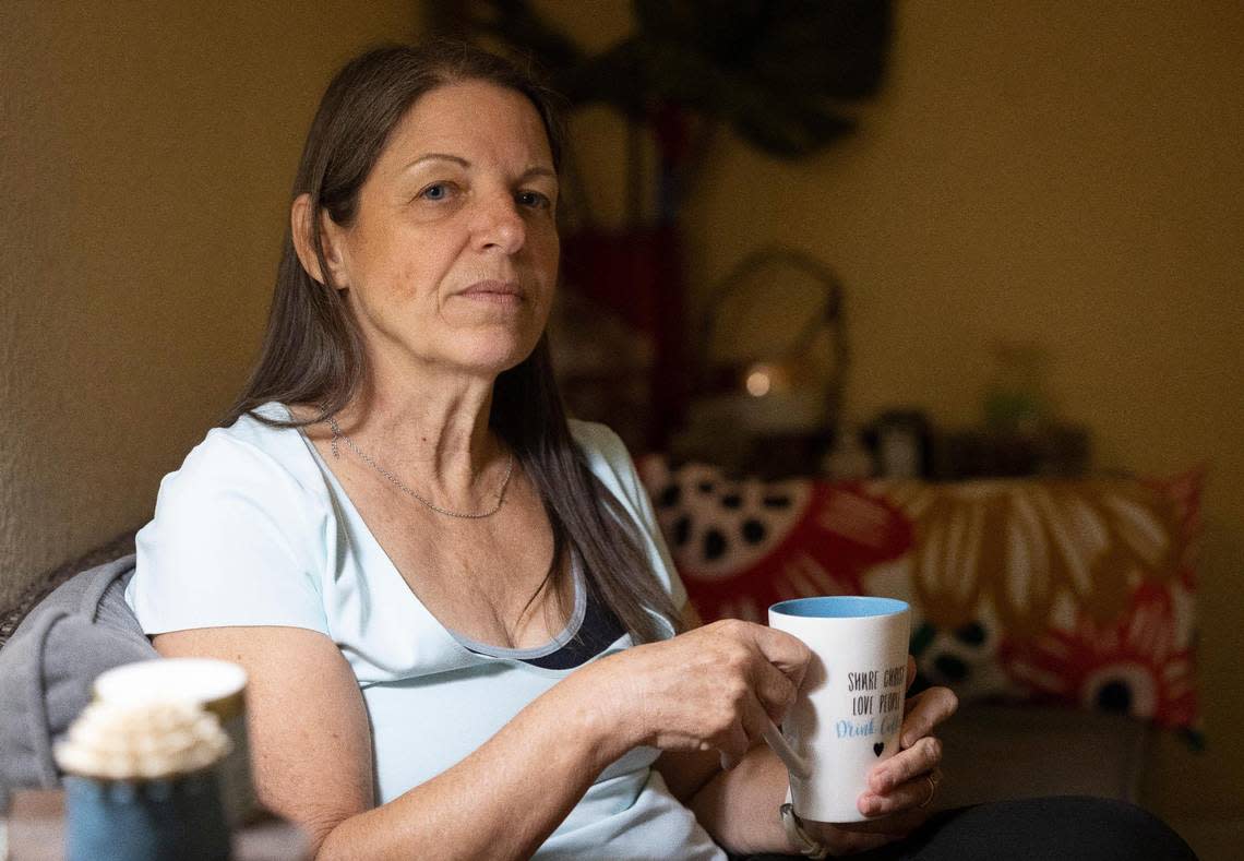 Isabel Toca, a breast cancer survivor, demonstrates ‘Tea Time’ in her home, Wednesday, Oct. 4, 2023, in Miami, Fla. She found help through a cancer survivors’ group focused on combating cancer-related stress.