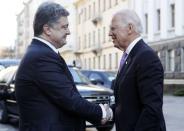 Ukraine's President Petro Poroshenko (L) shakes hands with U.S. Vice President Joe Biden before their meeting in Kiev, November 21, 2014. REUTERS/Valentyn Ogirenko