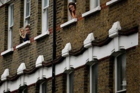 People watch a Remembrance Sunday parade through Fulham in West London, Britain November 8, 2015. REUTERS/Kevin Coombs