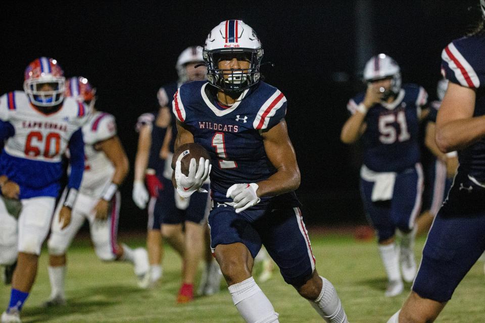 Malik Allen of the Estero High School football team gains yards against Cape Coral High School on Friday, Sept. 22, 2023. Estero won 38-0