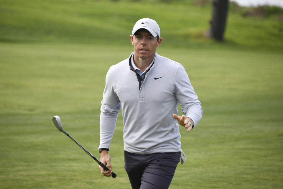 Rory McIlroy of Northern Ireland waves to the gallery after hitting out of a fairway bunker on the fourth hole of the South Course at Torrey Pines Golf Course during the second round of the Farmers Insurance golf tournament Friday Jan. 24, 2020, in San Diego. (AP Photo/Denis Poroy)