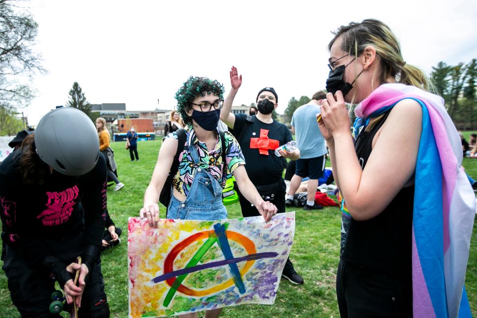 Protesters make music during a rally in support of transgender-rights as Matt Walsh speaks at an event hosted by the Young America's Foundation, Wednesday, April 19, 2023, at Hubbard Park on the University of Iowa campus in Iowa City, Iowa.
