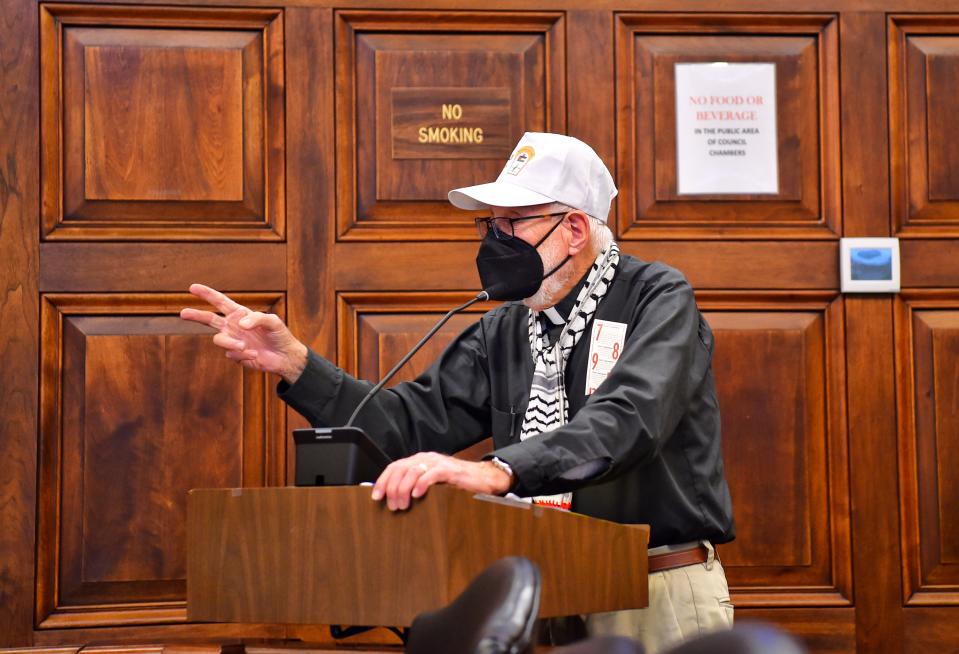 The Rev. John Beaty tries to address Akron City Council on Monday after failing to follow the council's registration process for the public comment period. A brief recess was called and he was escorted out of council chambers after his attempt to speak.