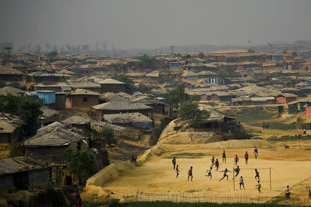 Rohingya refugees play football at Kutupalong refugee camp in Cox's Bazaar, Bangladesh, March 27, 2018. REUTERS/Clodagh Kilcoyne