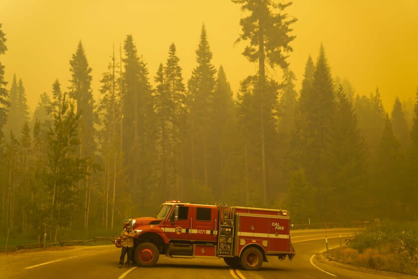 SHAVER LAKE, CA - SEPTEMBER 07: A CalFire engine stages in the middle of the road along CA-168 during the Creek Fire on Monday, Sept. 7, 2020 in Shaver Lake, CA. (Kent Nishimura / Los Angeles Times)