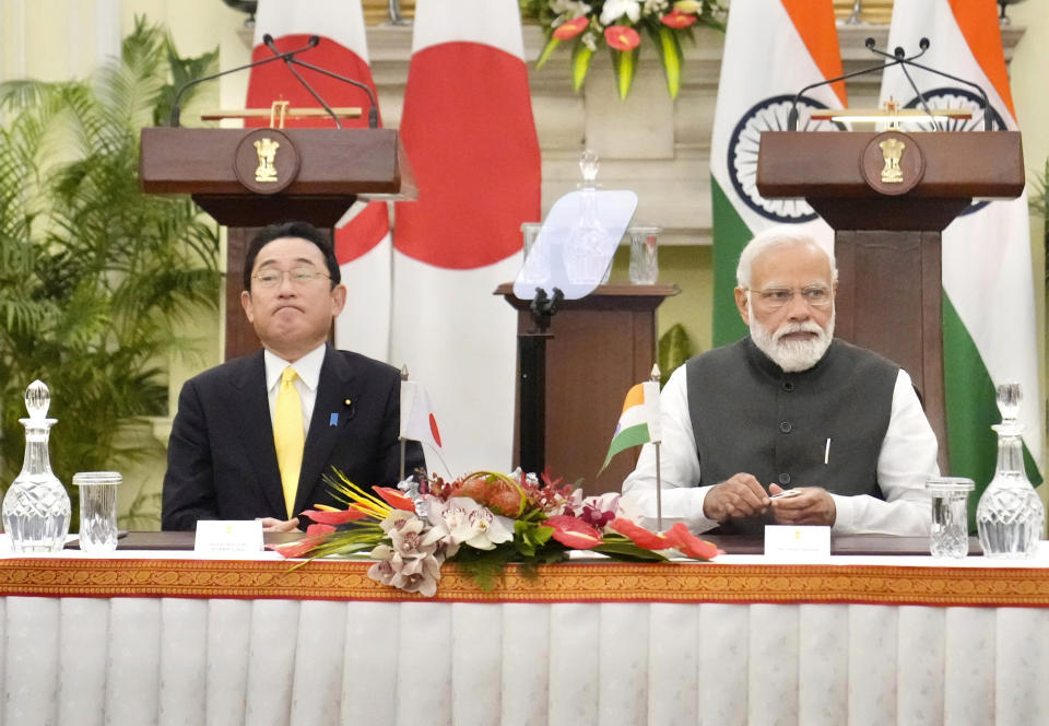 Indian Prime Minister Narendra Modi sits his Japanese counterpart Fumio Kishida during a signing of agreements in New Delhi, Saturday, March 19, 2022. Kishida Saturday said his country will invest $42 billion in India over the next five years in a deal that is expected to boost bilateral trade between New Delhi and Tokyo. (AP Photo/Manish Swarup)