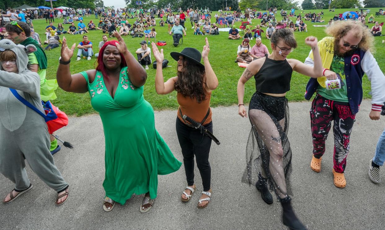 Shrek lovers groove to live music during Shrekfest Saturday, Sept. 3, 2022, at Humboldt Park in Milwaukee.