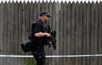<p>Armed police officers patrol a police cordon near the Manchester Arena in Manchester, Wednesday, May 24, 2017. Britons will find armed troops at vital locations Wednesday after the official threat level was raised to its highest point following a suicide bombing that killed more than 20, as new details emerged about the bomber. (AP Photo/Kirsty Wigglesworth) </p>