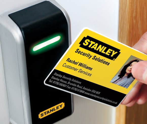 A security card with the Stanley logo on it being read by a Stanley card scanner.