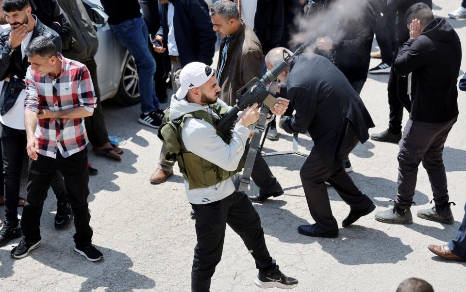 An armed man participates in the funeral of Mohammad Rasol Daraghmah, a militant who was killed by Israeli forces in Tubas