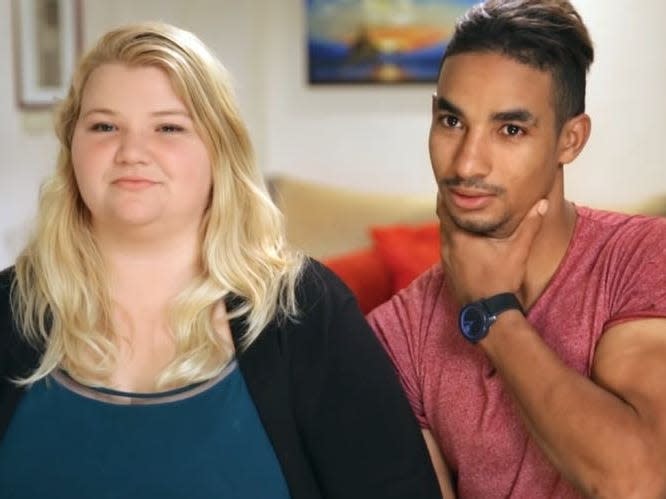 Nicole Nafziger and Azan Tefou staring into camera on 90 day fiance