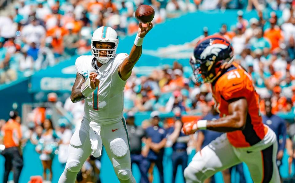 Miami Dolphins quarterback Tua Tagovailoa (1) passes the ball in the first half against the Denver Broncos at Hard Rock Stadium in Miami Gardens on Sunday, September 24, 2023.