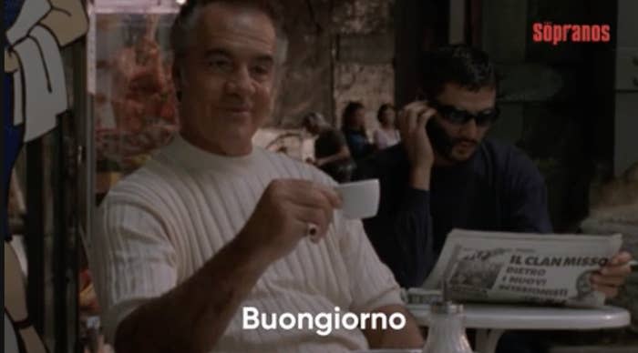 a man holding an espresso cup saying, "Buongiorno"