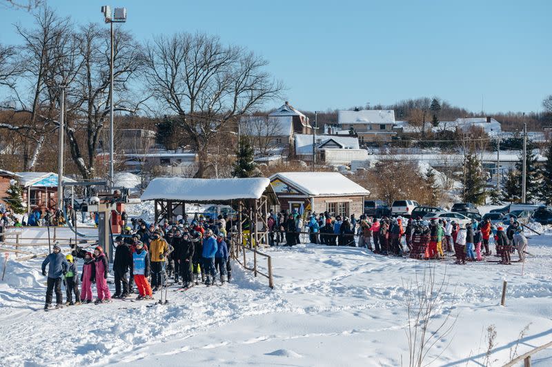 People queue to the ski lift after loosening of the coronavirus disease (COVID-19) restrictions in the reopened resort of Zakopane