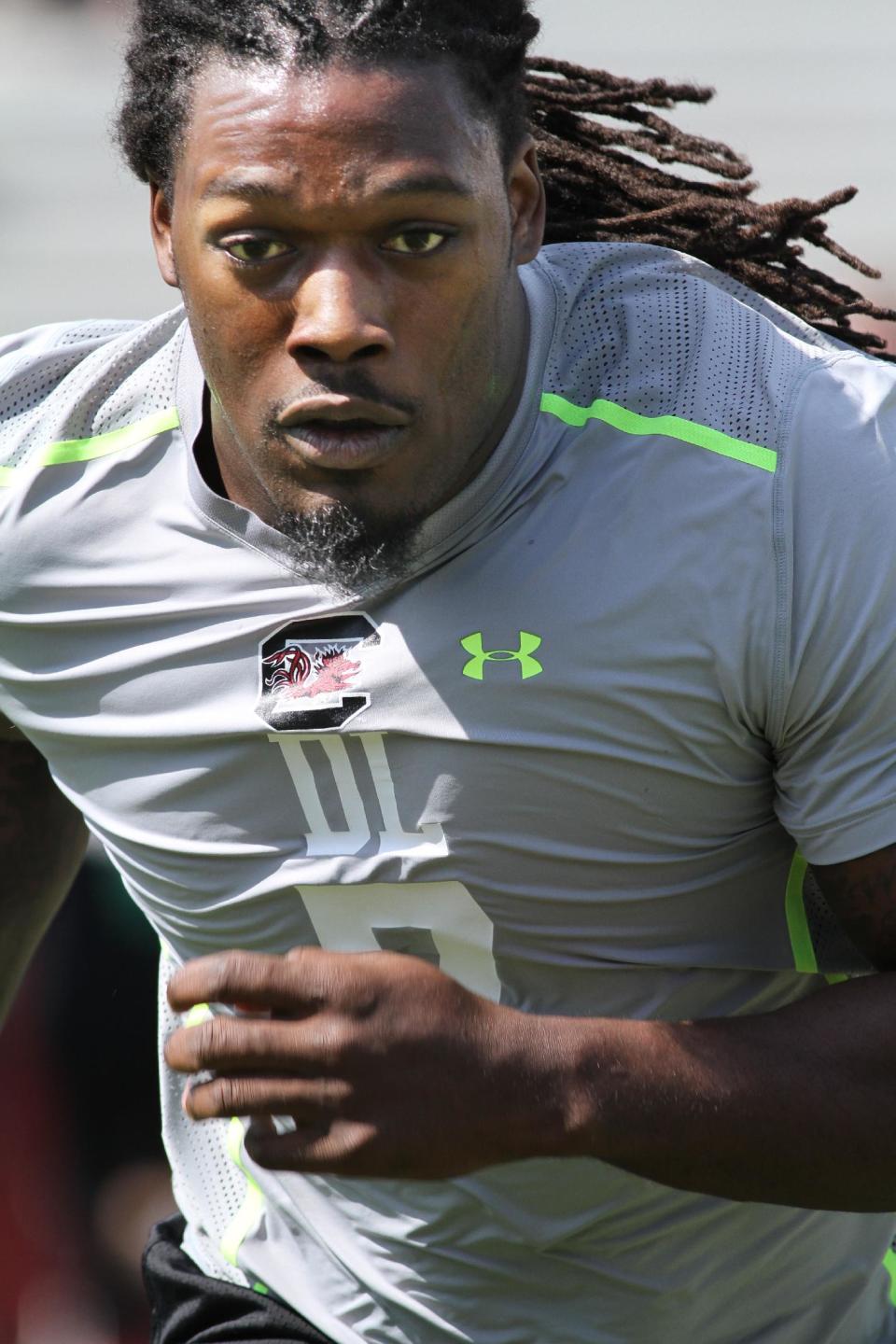 South Carolina defensive end Jadeveon Clowney competes in a drill for NFL representatives at South Carolina football pro day in Columbia, S.C., Wednesday, April 2, 2014. (AP Photo/Mary Ann Chastain)