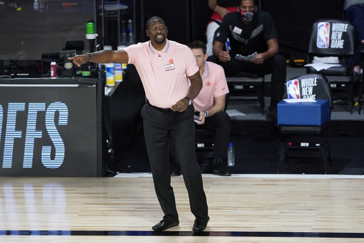 Assistant coach Adrian Griffin of the Toronto Raptors reacts during second-half action against the Philadelphia 76ers after head coach Nick Nurse stepped down for the night to let Griffin coach at The Field House at ESPN Wide World Of Sports Complex on August 12, 2020 in Lake Buena Vista, Florida. (Photo by Ashley Landis-Pool/Getty Images)