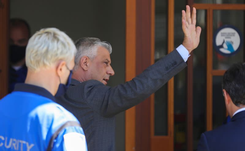 President Hashim Thaci waves as he arrives to be interviewed by war crimes prosecutors after being indicted by a special tribunal, in The Hague