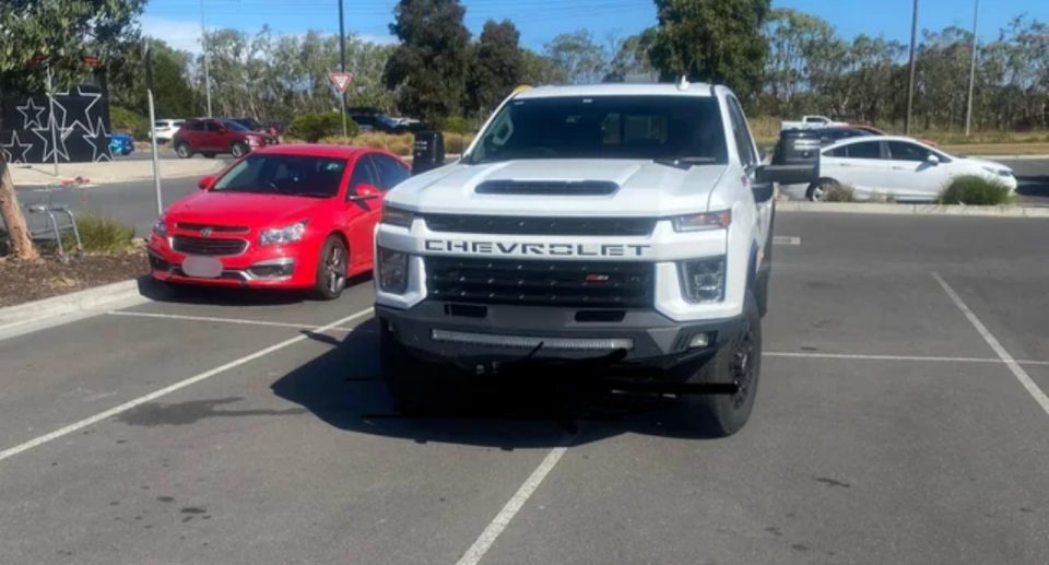 Photo of white oversized truck parked in four car spaces in Geelong.