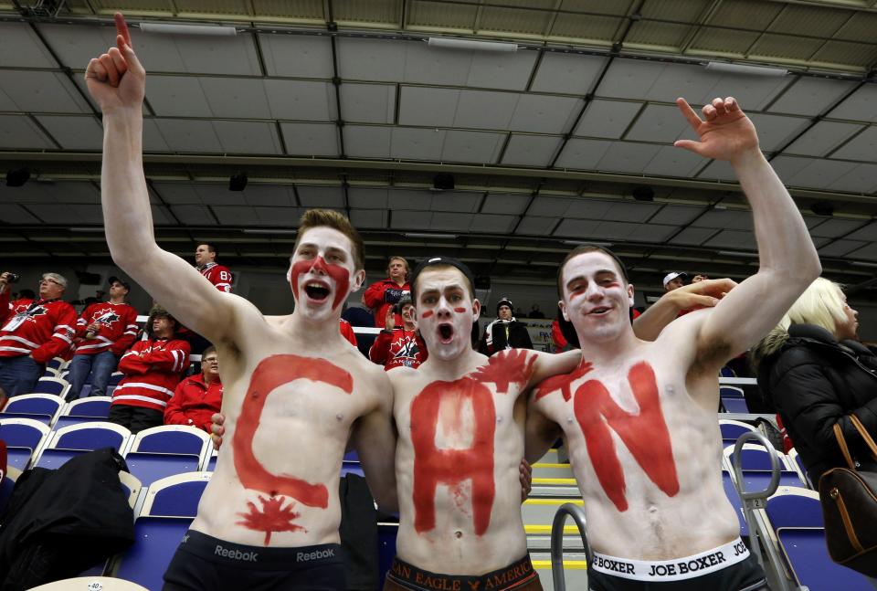 Canadian supporters cheer before Canada plays the United States in their IIHF World Junior Championship ice hockey game in Malmo