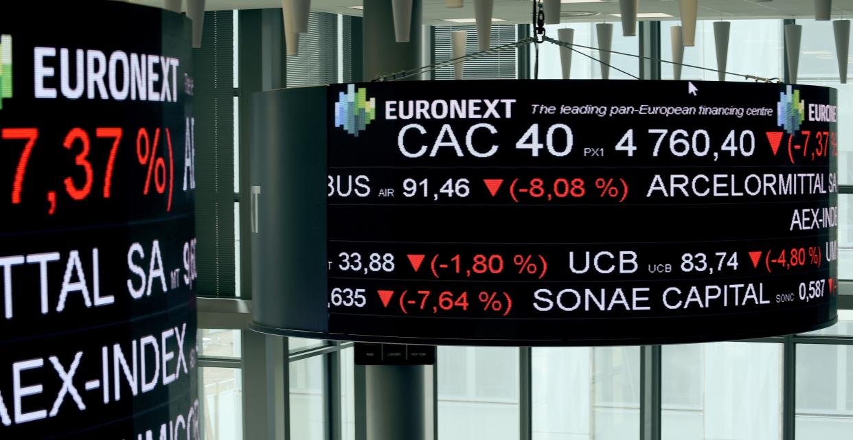 A screen displays the CAC 40 amongst stock tickers displayed at the headquarters of the Pan-European stock exchange Euronext, in La Defense district, near Paris, on March 9, 2020. - The Paris and Frankfurt stock exchanges fell more than 10 percent on March 12 afternoon trading after the European Central Bank unveiled a series of measures to shore up the eurozone economy but did not cut rates. The CAC 40 was down 10.2 percent to 4142.13 around 1340 GMT, while the DAX 30 in Frankfurt had tumbled 10.3 percent to 9,360.58. (Photo by ERIC PIERMONT / AFP) (Photo by ERIC PIERMONT/AFP via Getty Images)