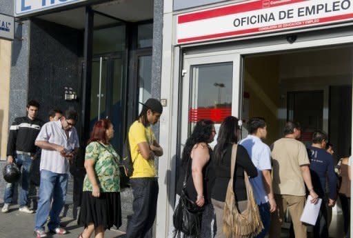 People queue at a government employment office in the centre of Madrid on June 4. The eurozone debt crisis delivered more bad news on Monday with data showing record high unemployment of 11.1 percent and a manufacturing outlook at its lowest levels for three years