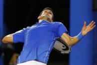 Novak Djokovic of Serbia serves to Andy Murray of Britain during their men's singles final match at the Australian Open 2015 tennis tournament in Melbourne February 1, 2015. REUTERS/Thomas Peter