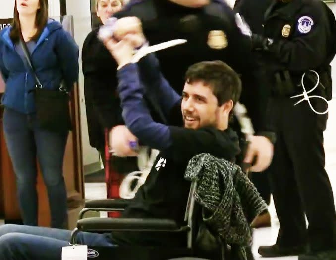 Ady Barkan raises his fists in triumph after getting arrested while protesting the tax bill on Dec. 18, 2017, his 34th birthday. (Photo: Center for Popular Democracy)