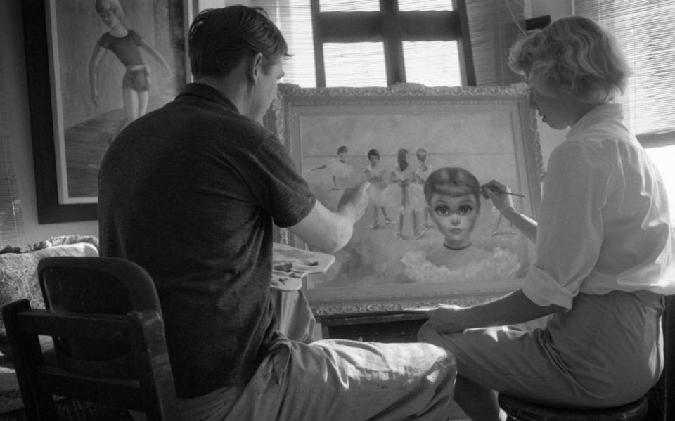 The original caption to this 1957 photograph read: 'In a unique example of togetherness, Walter and Margaret put the finishing touches on a joint effort which has already been framed. They frequently pool talents on one canvas, effecting an unusual combination that makes their paintings much in demand' - Bettmann