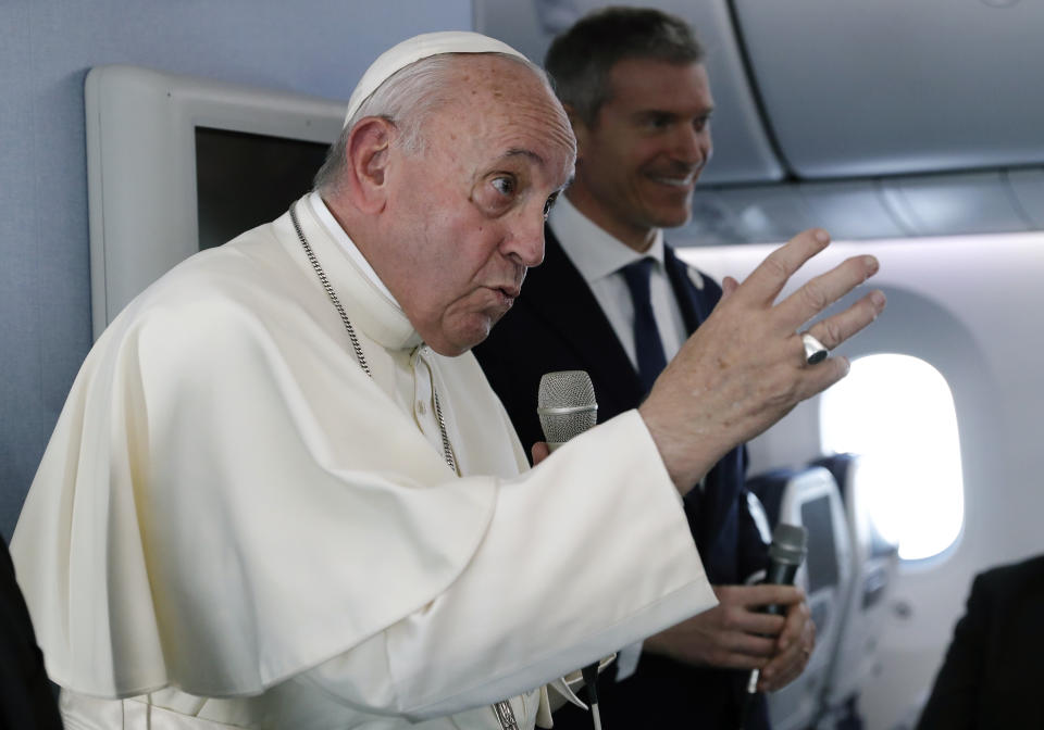 Pope Francis speaks during a news conference onboard the papal plane on his flight back from a trip to Thailand and Japan, Monday, Nov. 26, 2019. (Remo Casilli/Pool Photo via AP)