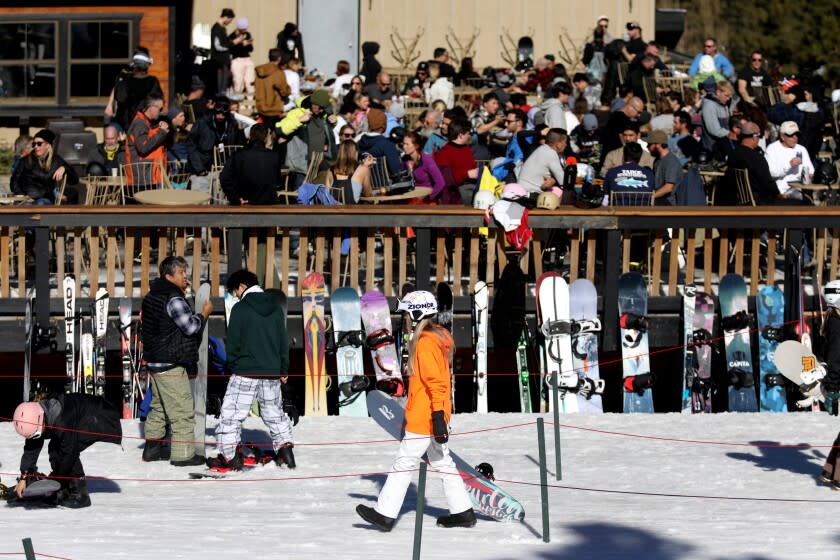 BIG BEAR LAKE, CA - JANUARY 05: Skiers and snowboarders at Snow Summit on Wednesday, Jan. 5, 2022 in Big Bear Lake, CA. Ski and snowboarding season is in full swing in mountain resorts like Big Bear. However, the timing of the storm clashed with an aggressive surge of COVID-19. (Gary Coronado / Los Angeles Times)