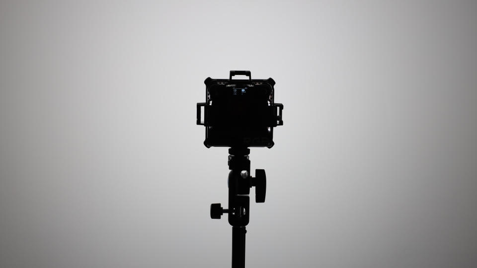 Zhiyun FIVERAY M20C LED panel on a light stand and pointed at a wall