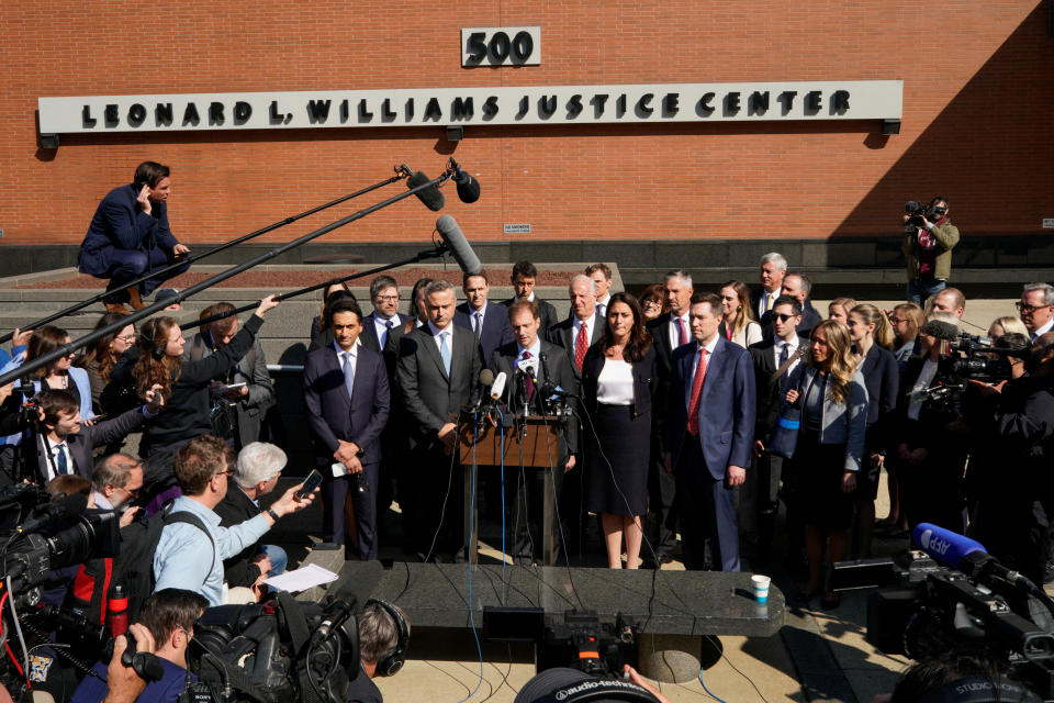 Dominion CEO John Poulos and lawyers speak to the media after Dominion Voting Systems and Fox settled a defamation lawsuit for $787.5 million, avoiding trial, over Fox's coverage of debunked election-rigging claims. (Eduardo Munoz/Reuters)