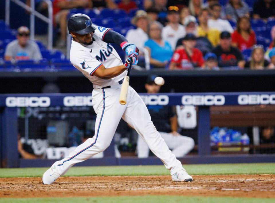 Miami Marlins second baseman Otto Lopez (61) hits a walk-off single and shortstop Tim Anderson (7) scores winning the game during the ninth inning of a baseball game on Wednesday, June 19, 2024 at loanDepot Park in Miami, Fla.