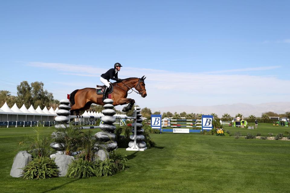 A professional show jumper competes during the Major League Show Jumping Tour at Desert International Horse Park in Thermal, Calif., on Thursday, December 1, 2022. The event, running through December 11th, is free and open to the public. 