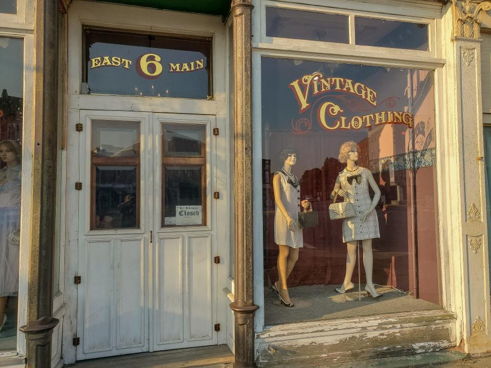 Mannequins watch the world go by from a storefront in Plymouth, Ohio. Note the dour look on the mannequin at the edge of the photo on the left.