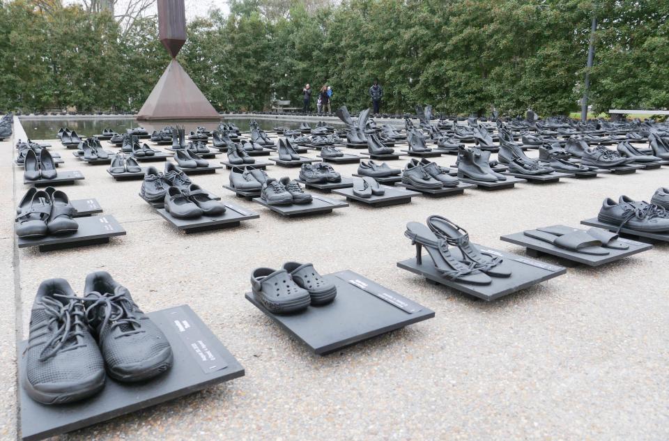 An installation by artist Sandeigh Kennedy of 657 pairs of shoes in memory of the more than 600 mass shootings that occurred in the United States in 2023 is seen in Houston, Texas.