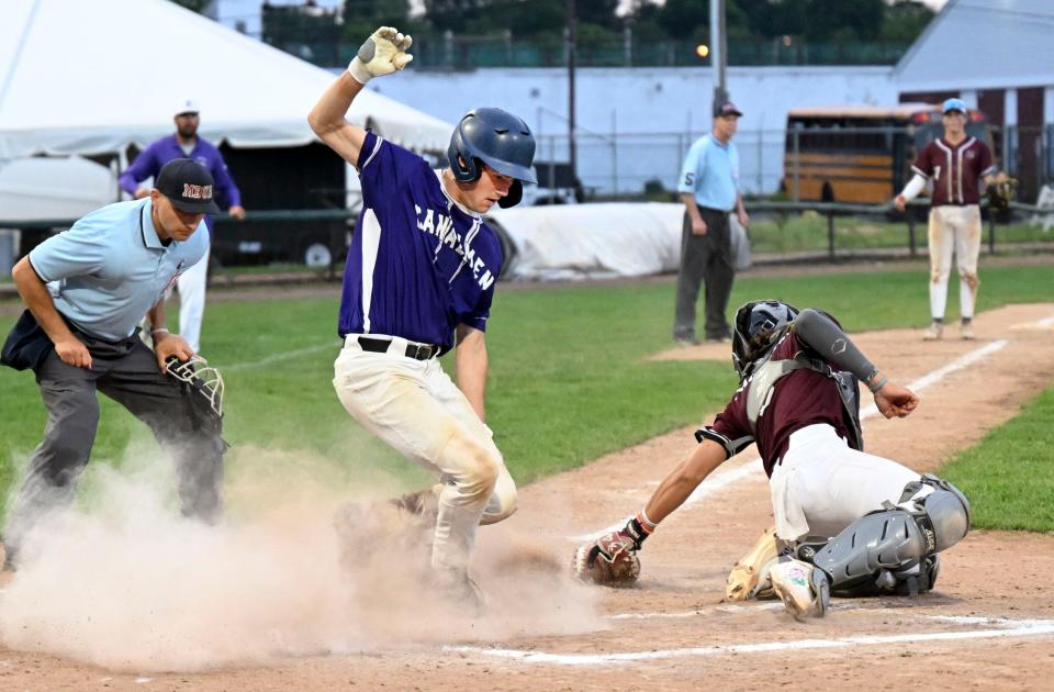 BROCKTON  06/13/23    Jack Ferreira of Bourne crosses the plate ahead of the tag by Ayer Shirley catcher Sam Oestreicher in the Division 5 semifinal baseball game