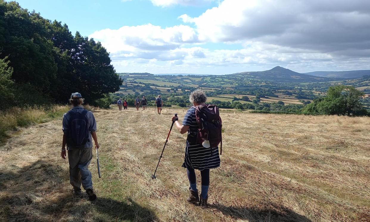 <span>The pilgrims in rural Herefordshire, walking towards the Skirrid, or Holy Mountain, over the border in Wales. </span><span>Photograph: Hugh Thomson</span>