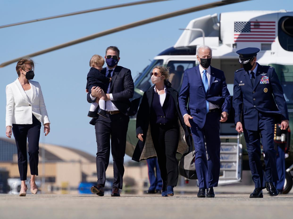 President Joe Biden walks with his son Hunter Biden before boarding Air Force One at Andrews Air Force Base on Friday, March 26, 2021. (AP)