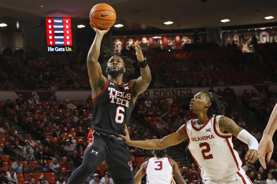 Texas Tech guard Joe Toussaint (6) prepares to shoot next to Oklahoma guard Javian McCollum (2) during the first half of an NCAA college basketball game, Saturday, Jan. 27, 2024, in Norman, Okla. (AP Photo/Nate Billings)