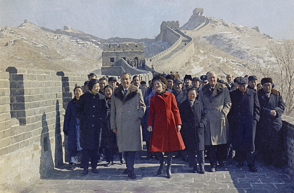 FILE - Then U.S. President Richard Nixon and then first lady Pat Nixon lead the way as they take a tour of China's famed Great Wall, near Beijing, Feb. 24, 1972. At the height of the Cold War, U.S. President Richard Nixon flew into communist China's center of power for a visit that over time would transform U.S.-China relations and China's position in the world in ways that were unimaginable at the time. (AP Photo, File)