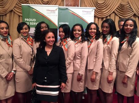 Ethiopian Airlines cabin crew pose for a photograph as they resume flights to Eritrea's capital Asmara at the Bole International Airport in Addis Ababa, Ethiopia July 18, 2018. REUTERS/Kumera Gemechu