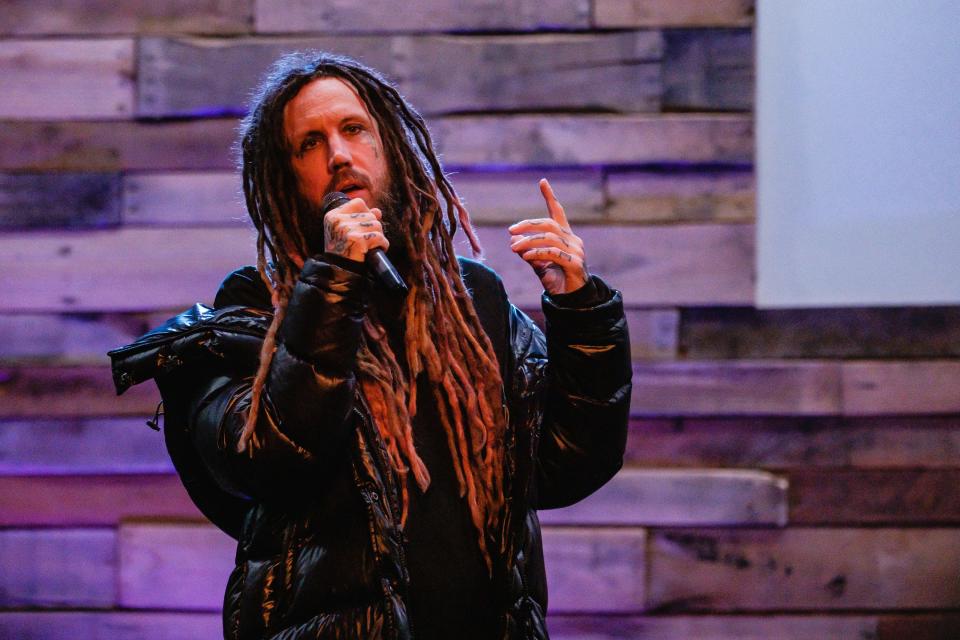 Brian "Head" Welch, vocalist and guitarist of the band Korn, speaks during a question-and-answer session with the Rev. Tommy Miller at an addiction recovery event at Legacy Church on Friday in New Philadelphia.