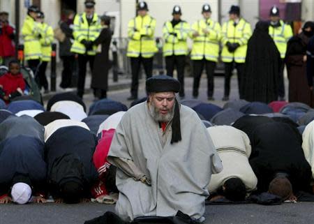 Muslim cleric, Abu Hamza al-Masri, is seen leading prayers outside the North London Central Mosque, in Finsbury Park, north London in this January 24, 2003 file photograph. REUTERS/Toby Melville/Files