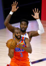 Oklahoma City Thunder's Chris Paul (3) is pressured by Phoenix Suns' Deandre Ayton during the third quarter of an NBA basketball game Monday, Aug. 10, 2020, in Lake Buena Vista, Fla. (Mike Ehrmann/Pool Photo via AP)