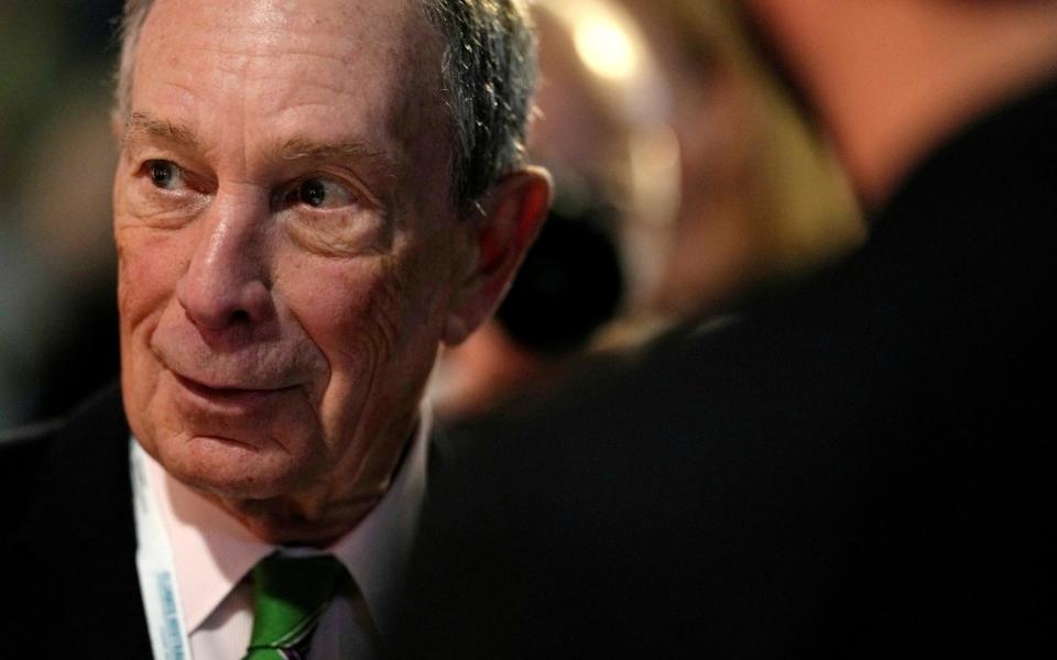 Former mayor of New York Michael Bloomberg speaks with participants prior to a meeting with Earthshot prize winners - REUTERS