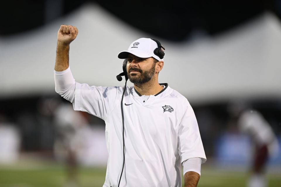 Ricky Santos has guided the University of New Hampshire football team into the NCAA Division I FCS tournament in his first season as head coach in 2022.